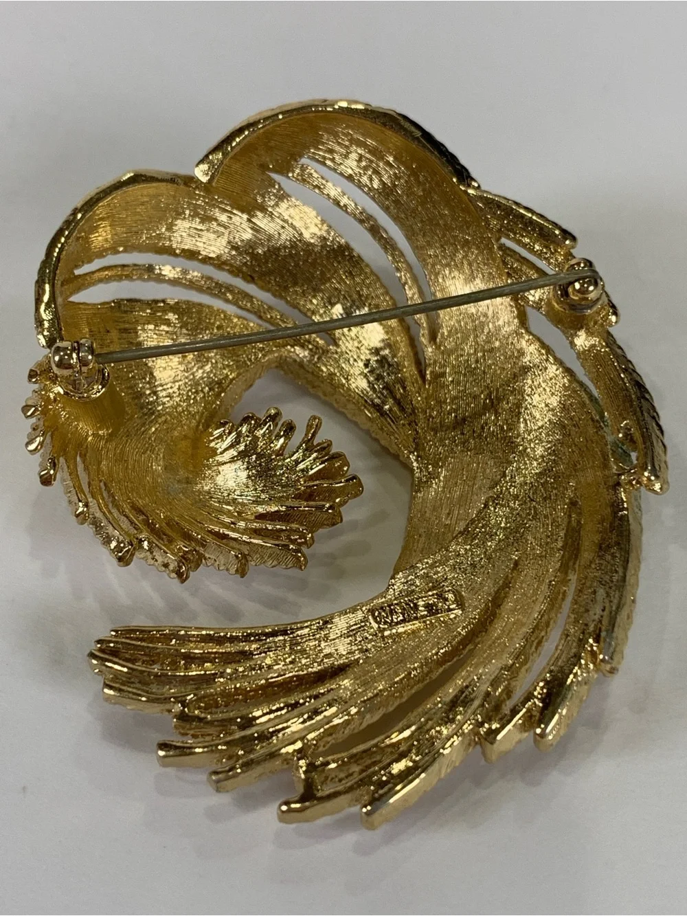 Vintage Monet Gold Tone Textured Swirl Brooch